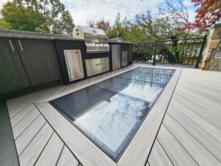  An outdoor kitchen on a deck with a glass floor